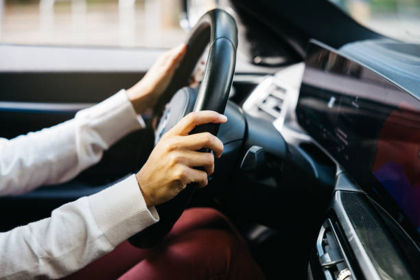 istock Driver gripping steering wheel in electric vehicle 2177901125