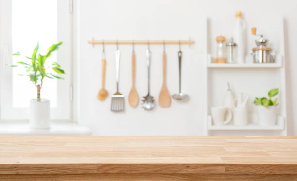 istock Empty wood table top and blur kitchen utensils interior background ready for product montage 2177901714