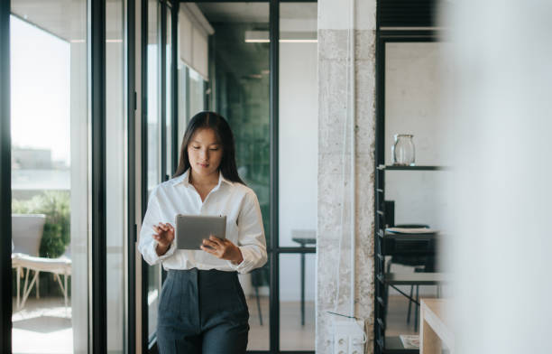 istock Young woman in office smiling while working 2177901945