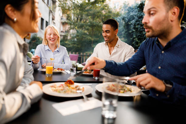 istock Happy entrepreneurs enjoying while having lunch in a restaurant. 2177904290