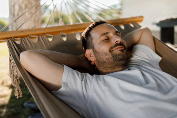 istock Relaxed man taking a nap in hammock. 2177906955