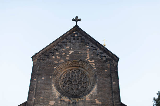 istock A beautiful church that features a cross prominently on its roof 2177908313