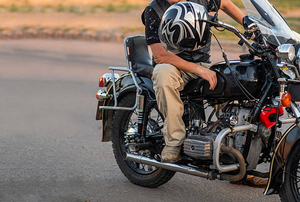 istock A biker is sitting on a motorbike resting 2177910374