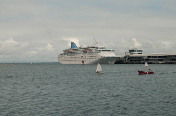 Madeira Island, Portugal. March 18, 2013. Image depicting a large cruise ship about to dock in the island's port. Madeira is a destination for thousands of visitors and tourists every year