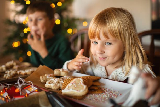 Children making Christmas cookies at home