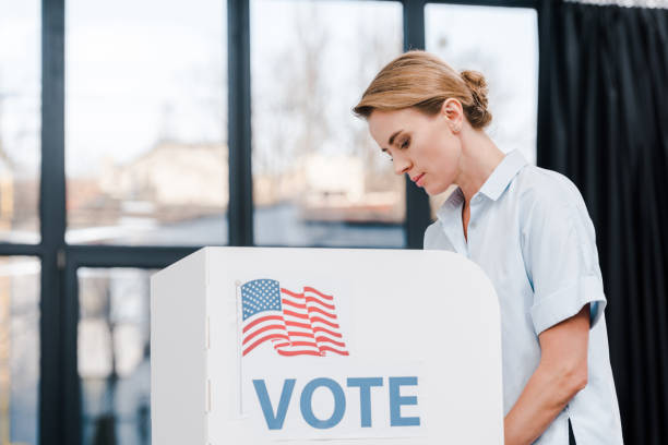 istock Voter engaging in the election process at a local polling station during voting hours 2177911423