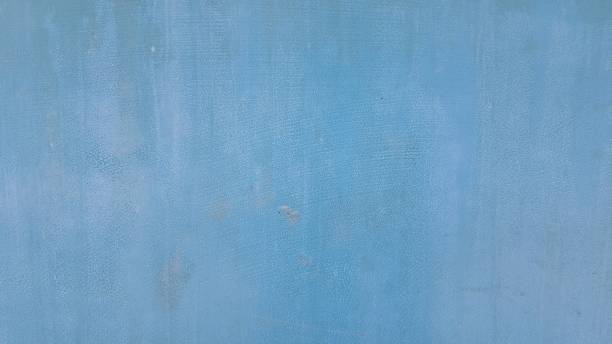 Texture of blue painted cement wall. The old blue wall is stained.