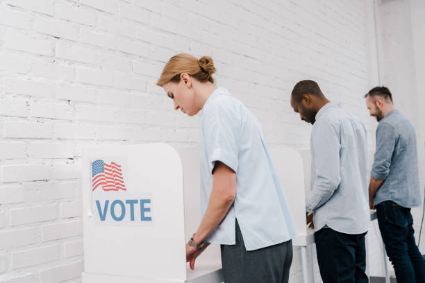 istock Citizens cast their votes in polling booths during an important election day gathering 2177911474