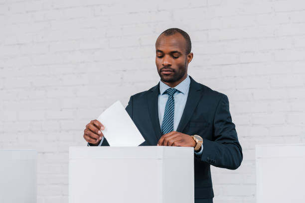 istock African american ethnicity voter engaged in the voting process at polling stations during a local election 2177911560