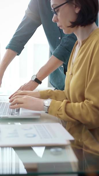 istock Team collaboration over financial reports. Business people, professionals analyzing financial charts and data on a desk near a laptop computer in flair office 2177911933