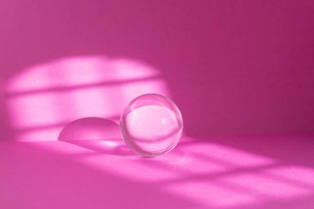 istock Abstract pink colored room background with window sun light trails and a glass sphere Backdrop with shadows of a window for product display defocused paper texture 2177913365