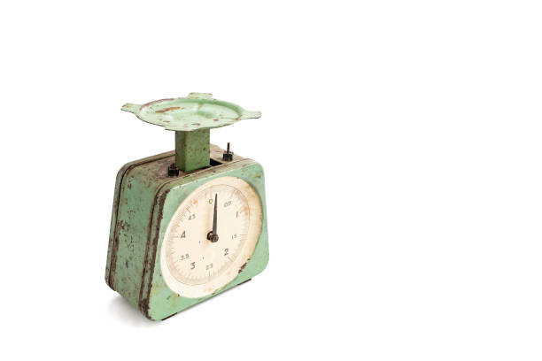 istock Obsolete vintage kitchen scale, with rust spots and green peeling paint, isolated on white background 2177913504