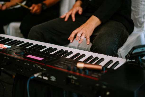 istock A close up shot of a persons hands playing a keyboard 2177913770