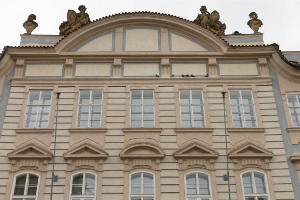 istock A large building with many windows and ornate statues on the roof 2177915329