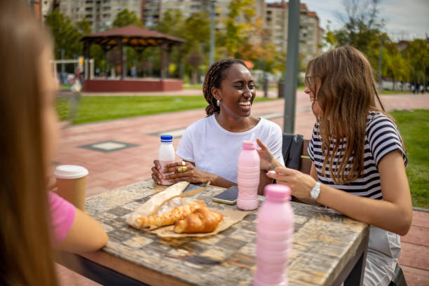 istock Laughter over breakfast time in public park 2177927640