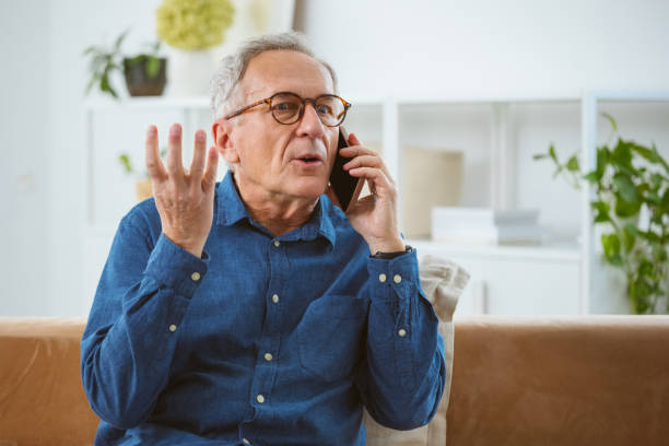 istock Displeased senior man talking on phone 2177928438