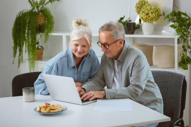 istock Senior couple using laptop at home 2177928767