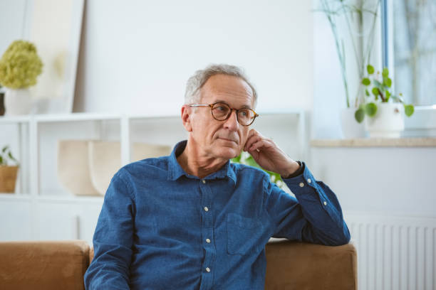 Thoughtful senior man at home