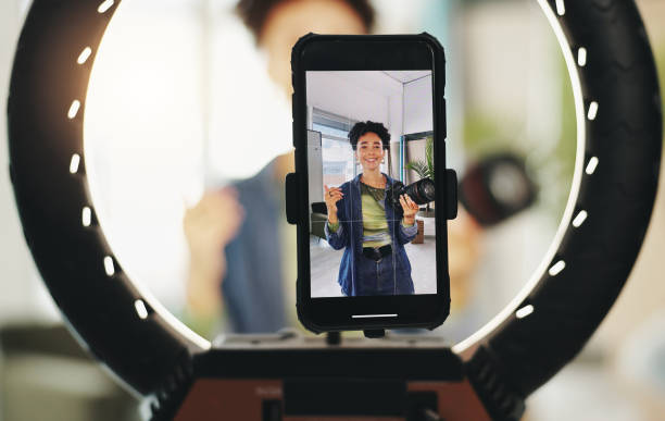 istock Happy woman, portrait and phone with ring light for tutorial, photography tips or online content at studio. Young, female person or influencer with camera for live recording, broadcast or advice 2177931413