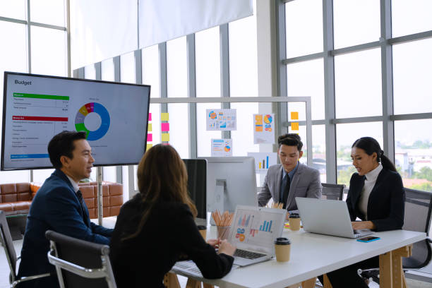 istock White collar workers are meeting at modern office. 2177933202