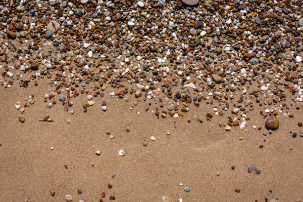 View from above of the sand and pebbles background.