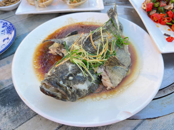 Steamed grouper with soy sauce in Chinese style at a local restaurant in China