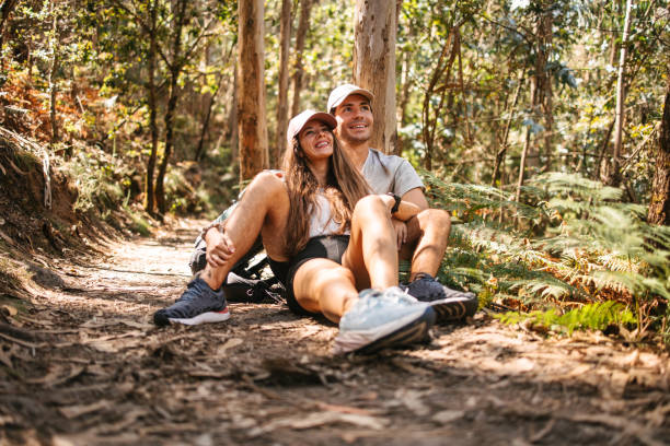 istock Couple of hikers under the tree 2177934832