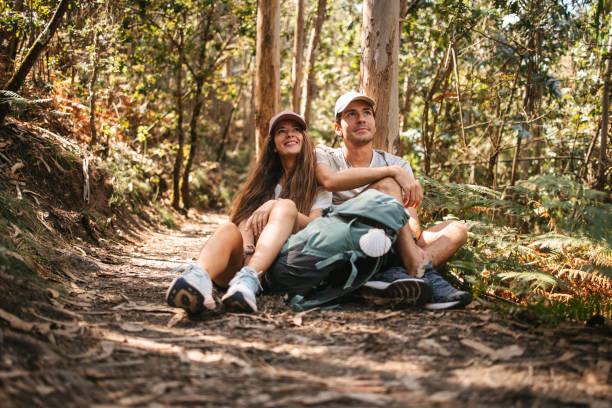 Couple of hikers under the tree