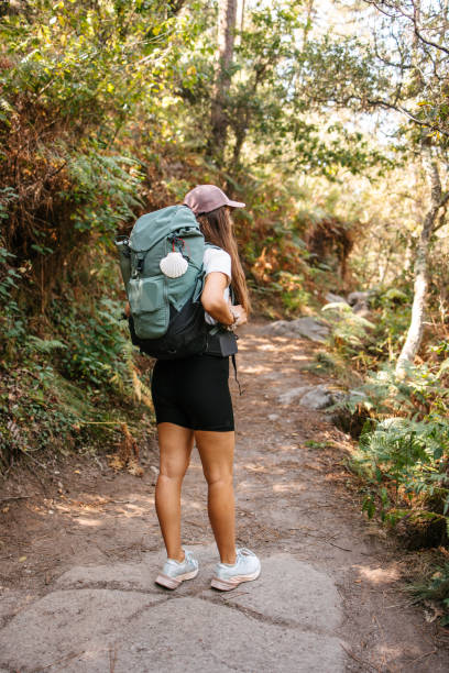 istock Backpacker walking in the woods 2177934840