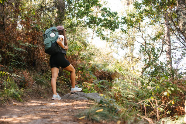 istock Female backpacker enjoying in nature 2177934844