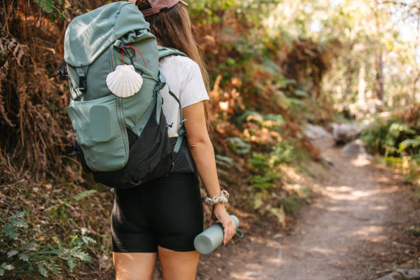 istock A backpacker standing in the woods and holding water battle 2177934849
