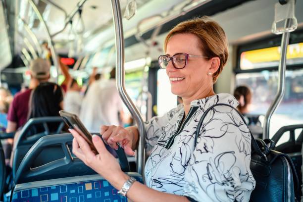 istock Woman using phone in public transportation while traveling 2177938180