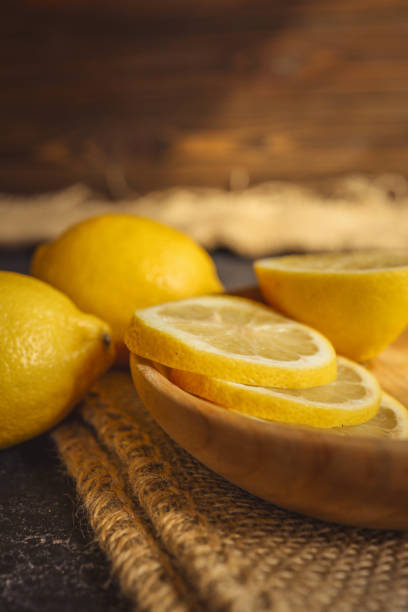 istock Fresh and juicy lemon on a dark rustic background 2177938488