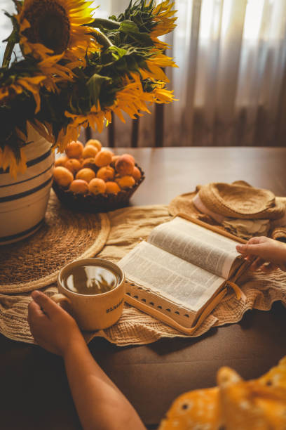 istock Girl reading bible, home evening atmosphere 2177940213