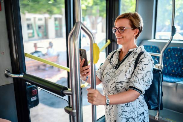 istock Woman using phone in public transportation while traveling 2177943913
