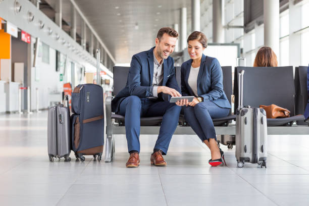istock Business couple waiting for flight using digital tablet 2177947745