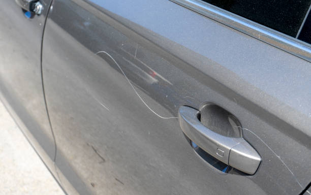 istock vandalism scratches on a car door 2177949932
