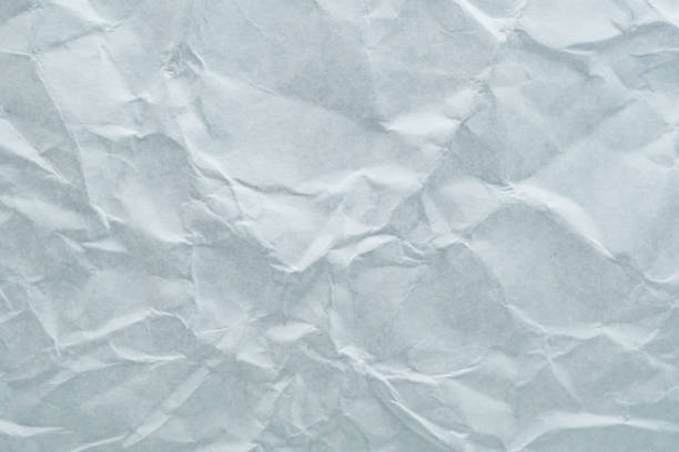 A close-up view of crumpled paper texture, providing a unique backdrop for creative projects and designs.