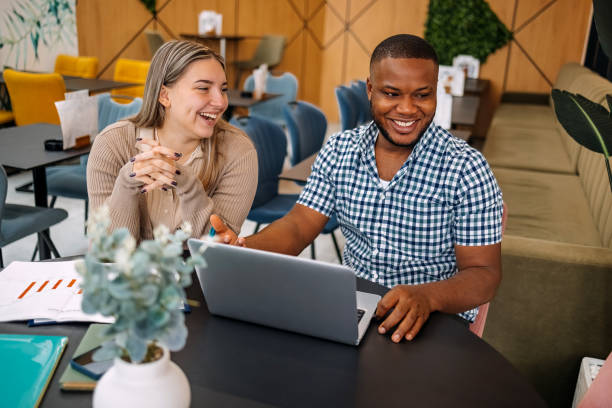istock Colleagues working together going through charts and looking at laptop 2177950835