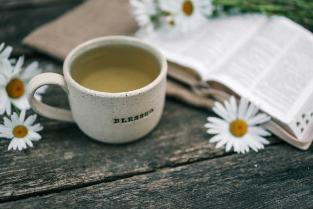istock Cup with the inscription blessed and open Bible, Christian concept 2177951720