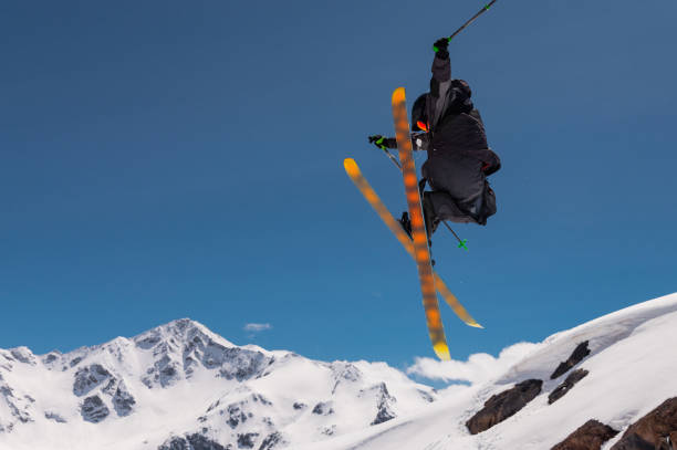 istock Stylish skiing trick in snowy high sharp mountains. The athlete is flying 2177952686