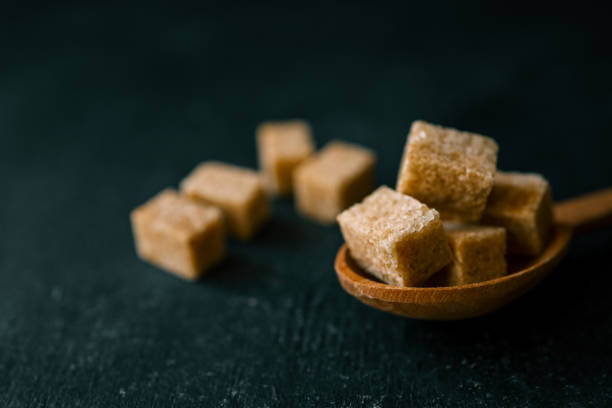brown sugar heap and wooden spoon.