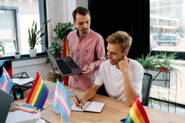 istock Young gay couple collaborating in a vibrant office, celebrating pride while working together 2177954564