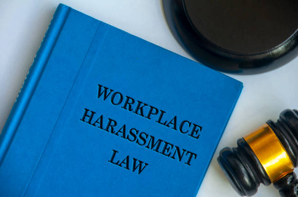 istock Top view of Workplace Harassment Policy blue book with gavel on white background. Zero workplace harassment concept 2177954674