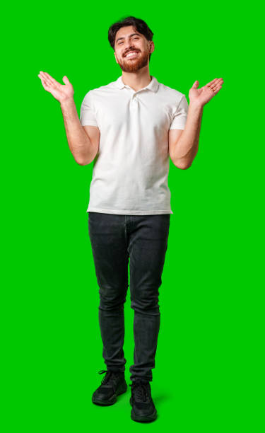 istock A smiling man with outstretched arms welcomes you against a bright green backdrop 2177955807