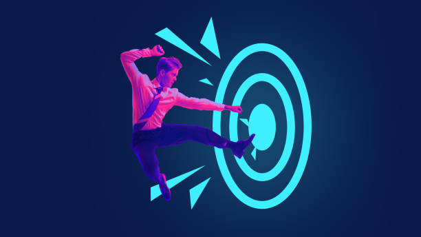 istock Businessman kicking through glowing target with powerful determination. Breaking through obstacles to hit business targets. 2177957880