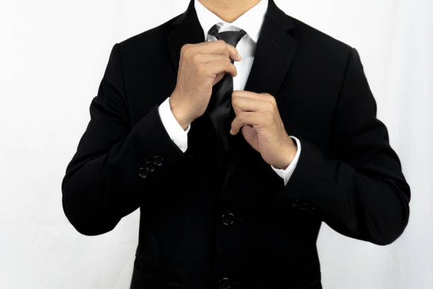istock businessman correcting tie fashion on grey background. 2177959544
