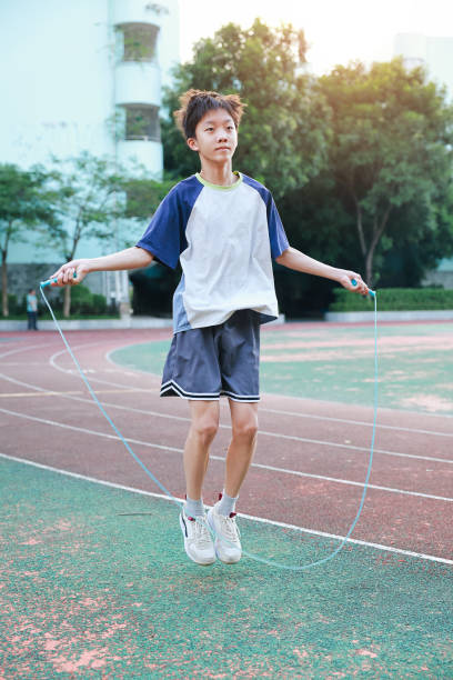 istock Little boy jumping rope on the playground 2177959633