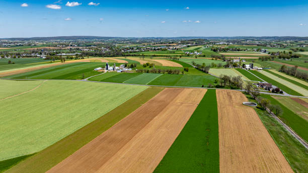 istock Lush Rolling Fields Cover the Landscape in a Rural Area During a Clear Sunny Day in Spring 2177960092