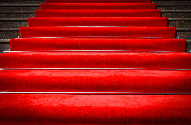 istock Red carpet on stairs and spotlight with light 2177967918